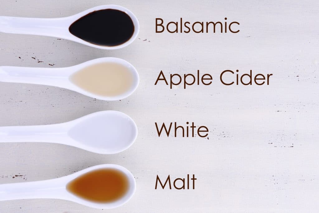 Serving size samples of different types of vinegar including Balsamic, Apple Cider, White and Malt vinegars, with text names added.